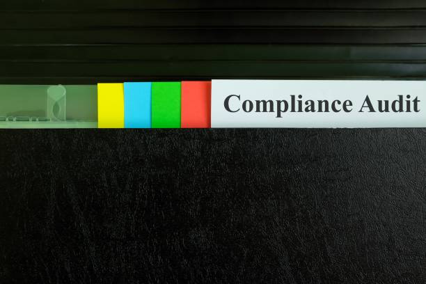 istock Compliance audit file report in black binder folder. Business management concept. 1442378309