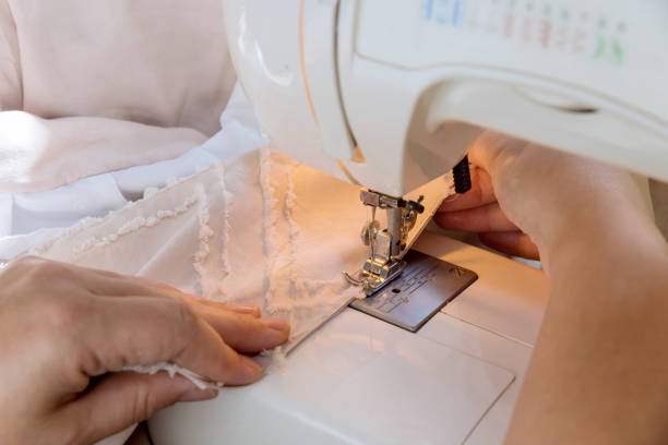 istock During the workday, tailor seamstresses sew clothes on sewing machines in their workplace 1442378752