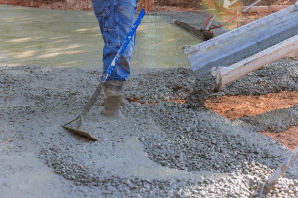 istock Paving a driveway with wet concrete while concrete construction contractors work on pouring it 1442378763