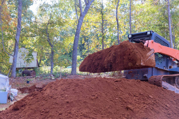 istock On a construction site, a small tractor is used to move soil to create a landscape. 1442378799