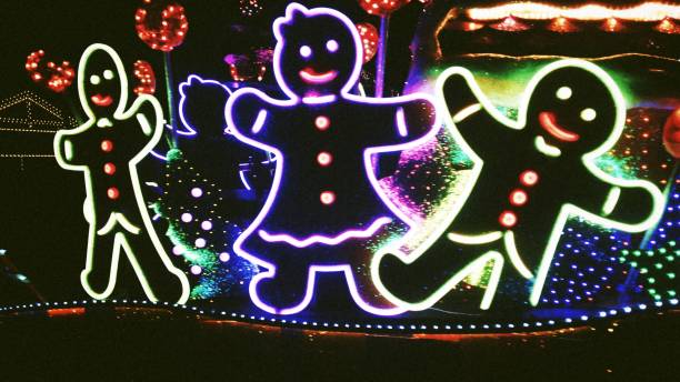 A beautiful Christmas light display depicting a gingerbread woman and gingerbread men.