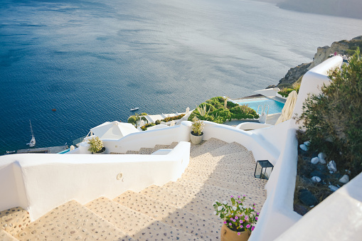 White staircases and Mediterranean sea view natural view scene background tourist residence and housing resort at Oia village, Santorini,Greec
