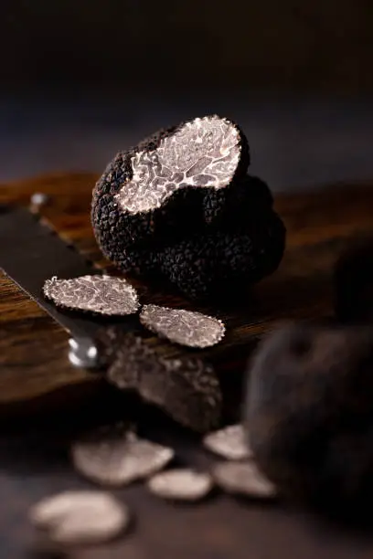 Photo of Thinly Sliced Truffle, Dark Background