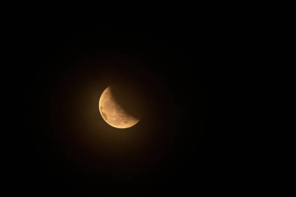 istock Real full blood moon, half moon in black sky with cloud 1442384044