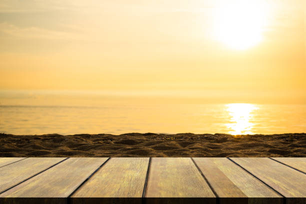 istock Empty Wooden Table on blur Sea with Sunset Background 1442386306