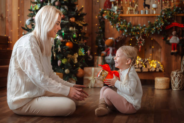 istock Mom gives a gift to her daughter 1442388689