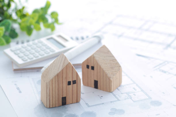 A model of a wooden house and an image of my home design stock photo