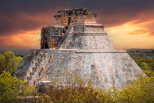 Uxmal, Mexico. Pyramid of the Magician in ancient jungle Mayan city Uxmal, Yucatan Peninsula.