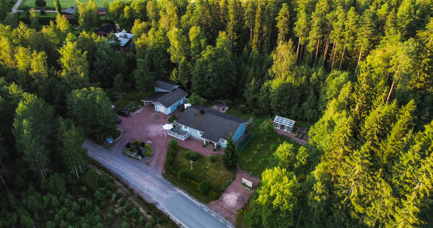 Aerial drone view above a detached house, summer evening
