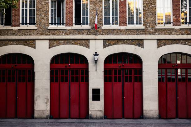istock Fire station building exterior with red gates 1442406535