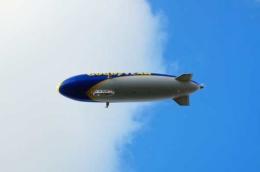 Goodyear Zeppelin, airship in Friedrichshafen.\nHe takes off on a sightseeing flight over Lake Constance and the Alps. The passengers enjoy the beautiful landscape