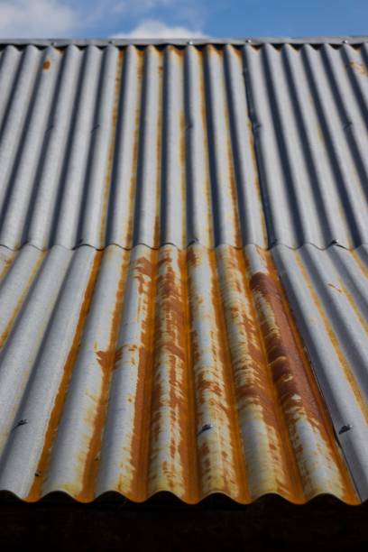 istock Rusty metal rooftop under the blue sky 1442407514