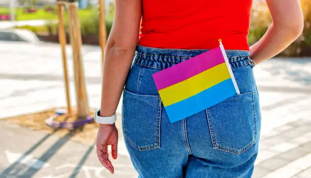 A small LGBT pansexual flag in jeans pocket