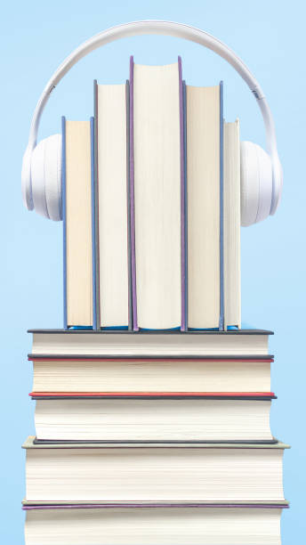 istock Closeup of a stack of books with headset- concept for audio book 1442410606