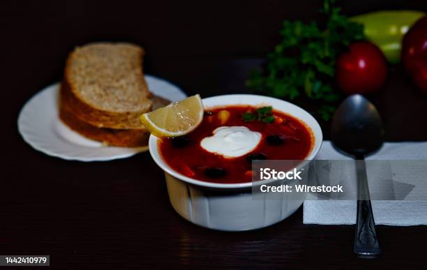 Bowl Of Russian Meat Soup Hodgepodge With Olives And Sour Cream On A Dark Table Stock Photo - Download Image Now