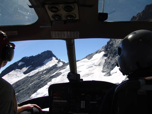 istock Pilots' view during the flight over mountains from the helicopter cabin 1442411110