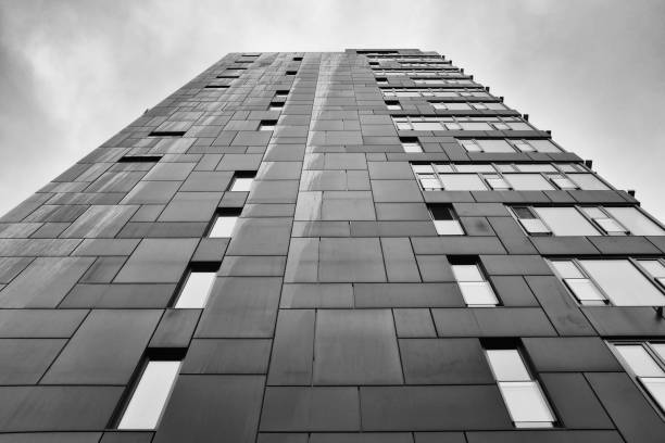 istock low angle view of buildings against cloudy sky 1442411784