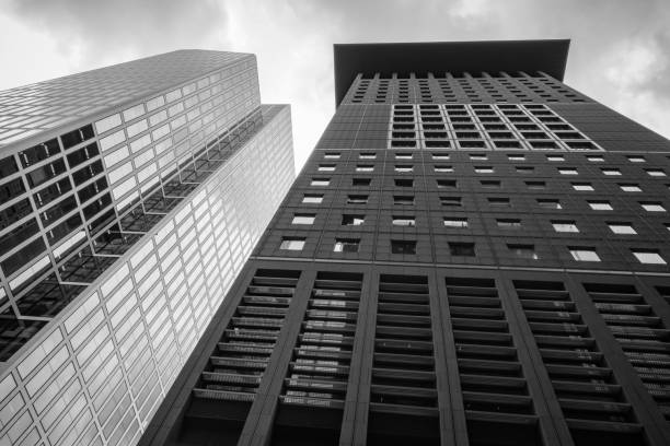 istock low angle view of office buildings against cloudy sky 1442411831