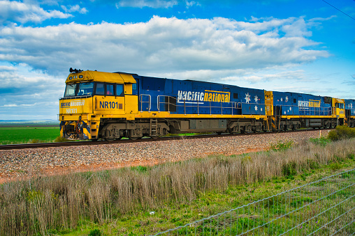 outback, Australia – August 17, 2017: A freight train transporting containers on Australian railway