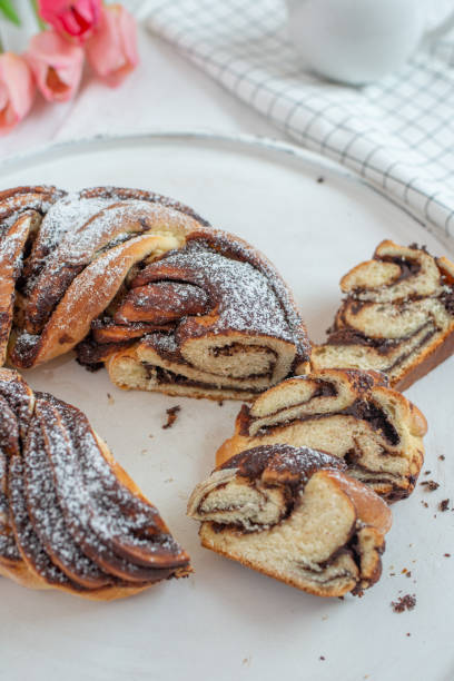 Freshly baked chocolate swirl bread or brioche A freshly baked chocolate swirl bread or brioche braided buns stock pictures, royalty-free photos & images