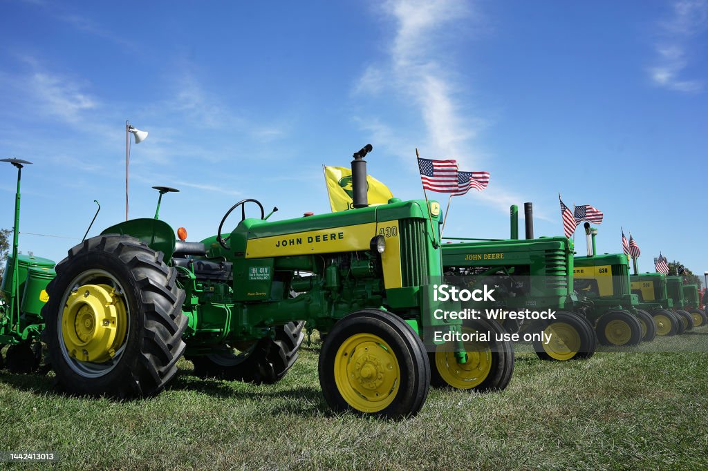 John Deere Vintage Classic Tractor Show with US flags Kansas City, United States – October 11, 2021: The John Deere Vintage Classic Tractor Show with US flags John Deere Stock Photo