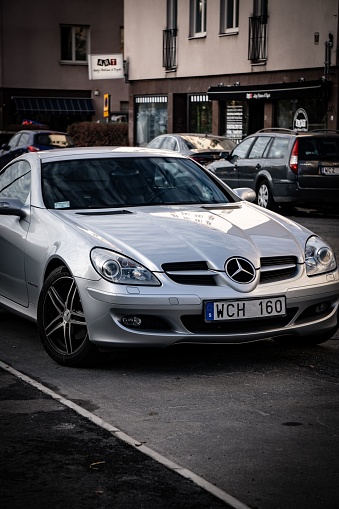 Stockholm, Sweden – October 24, 2022: Mercedes Benz SLK 200 next to the sidewalk