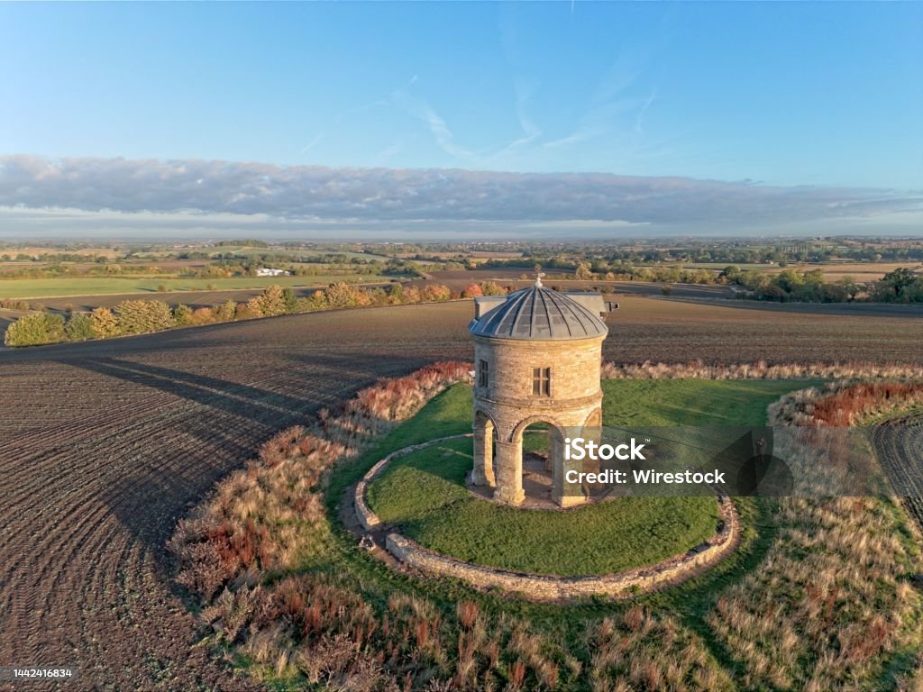 Aerial view of Chesterton Windmill at sunrise in Warwickshire An aerial view of Chesterton Windmill at sunrise in Warwickshire Architecture Stock Photo