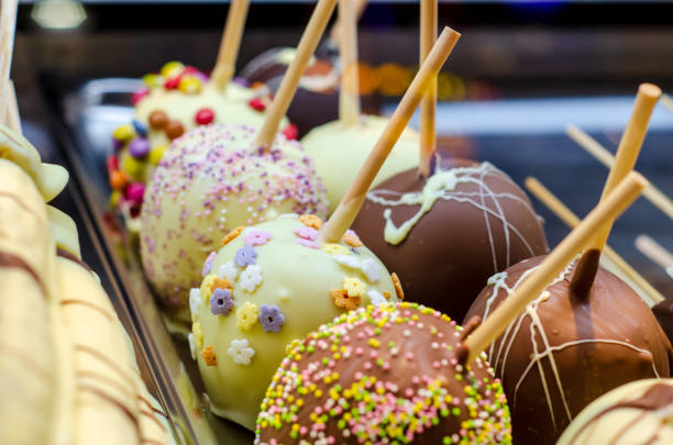 Apples covered in chocolate for sale at the fair.