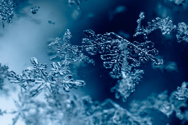 istock Melting snowflakes on a glass surface 1442417213