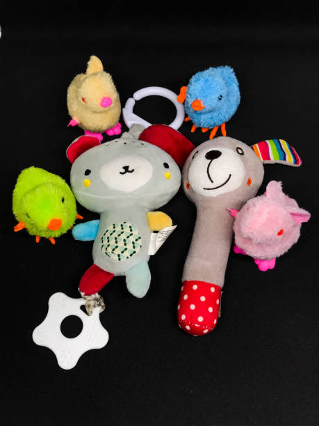 istock Toys and dolls isolated on black background 1442417237