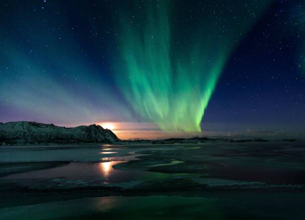 istock Colorful aurora borealis in the sky over the river 1442417241