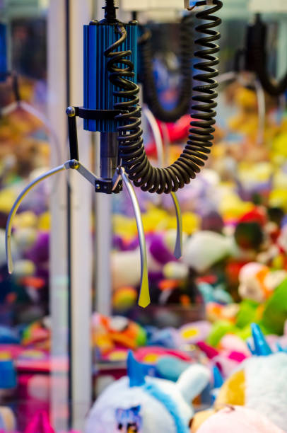 istock A claw crane game machine with toys 1442417374