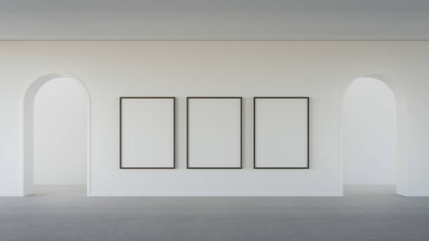 istock Empty white blank picture frame on concrete wall and arched door in modern house or luxury hotel. 1442417527