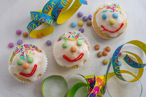 A closeup shot of carnival clown muffins on a white counter