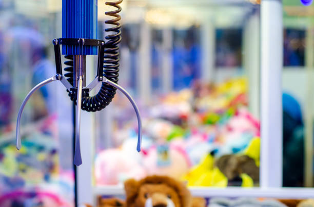 istock A claw crane game machine with toys 1442418220