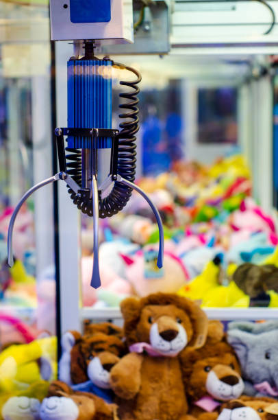 istock A claw crane game machine with toys 1442418360