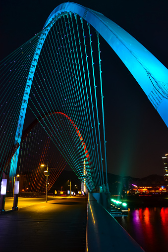 A vertical shot of the blue arch of Expo Bridge, Daejeon, South Korea.