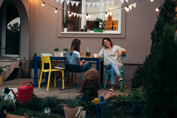 istock mother and daughter feels satisfied while sitting on terrace in their backyard 1442418791