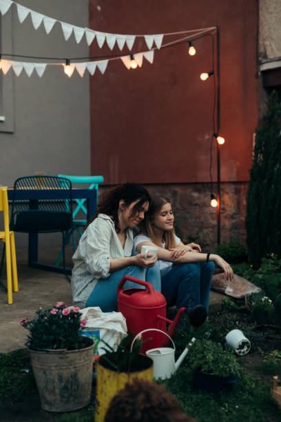 istock mother and daughter sitting and enjoying in backyard 1442418916