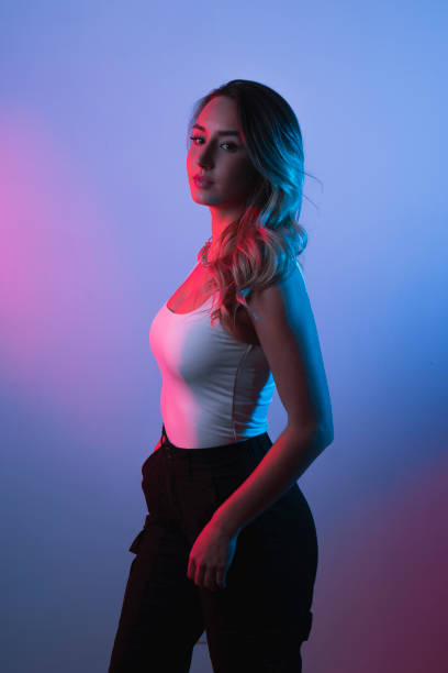 istock A young attractive Caucasian female posing under neon lights 1442420625