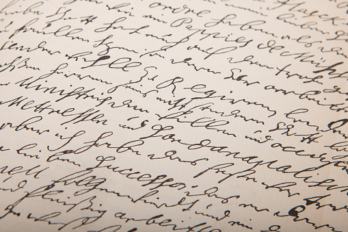 A closeup of an old handwriting, vintage letter. Handwriting. Seamless vector background