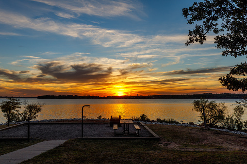 A scenery of cloudy sunset at Lake Thunderbird in Norman, Oklahoma, the USA
