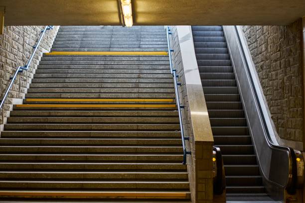 istock Underground stairway next to escalator 1442423429