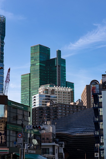 Toky, Japan – September 06, 2022: A vertical shot of the Tokyo buildings during a summer afternoon