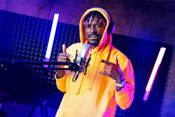 istock Young African performer recording his new track in recording studio 1442426995