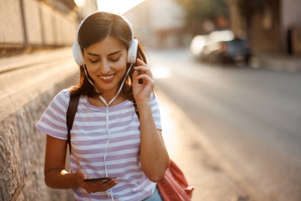 istock Enjoying good music while walking in the city 1442427046