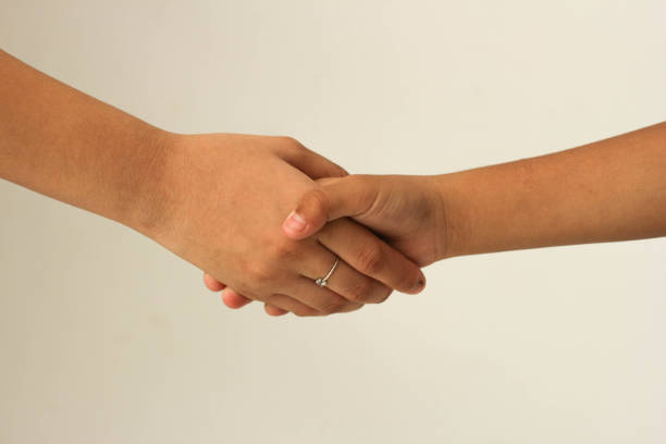 istock Shaking hands of two kids, isolated on white. copy space. 1442427850