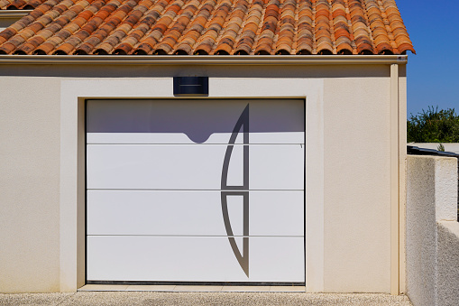sectional garage door design white home facade