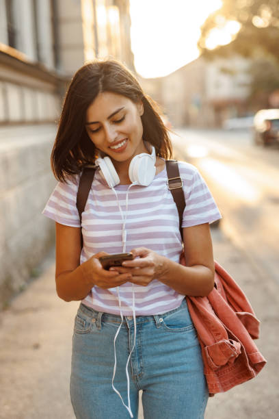 istock Young woman texting in the city 1442428882