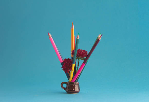 istock Art creative idea concept, pencils with burgundy aster flowers in ceramic mug. 1442429030